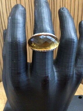 925 silver ring with topaz colored stone surrounded by rhinestones. Size 8